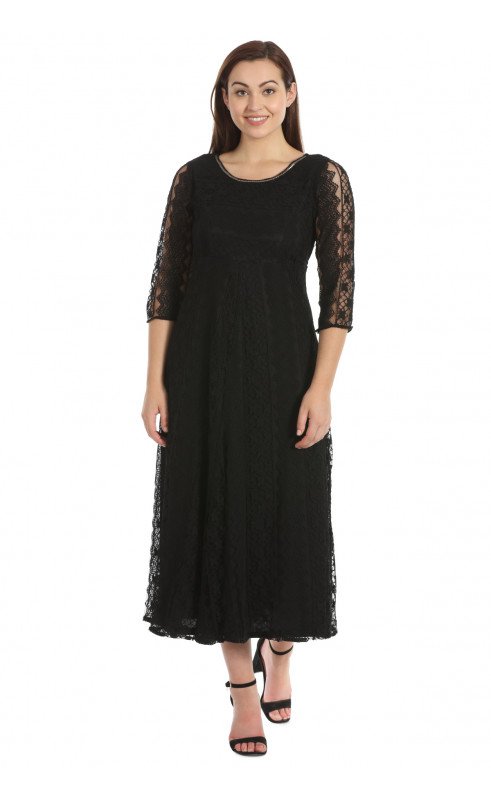 woman wearing a black dress with net sleeves