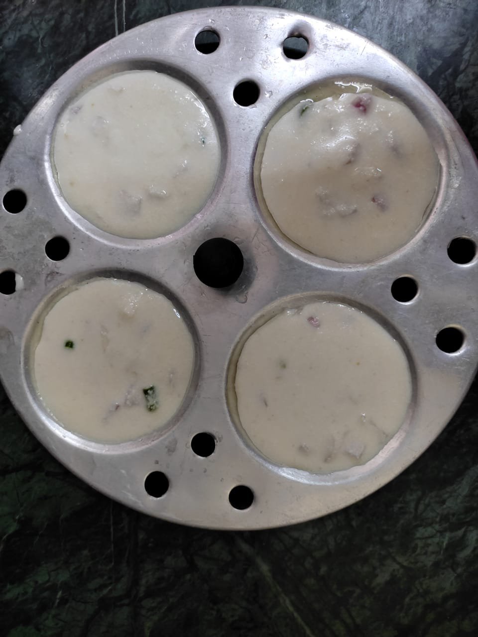 idli batter in idli moulds