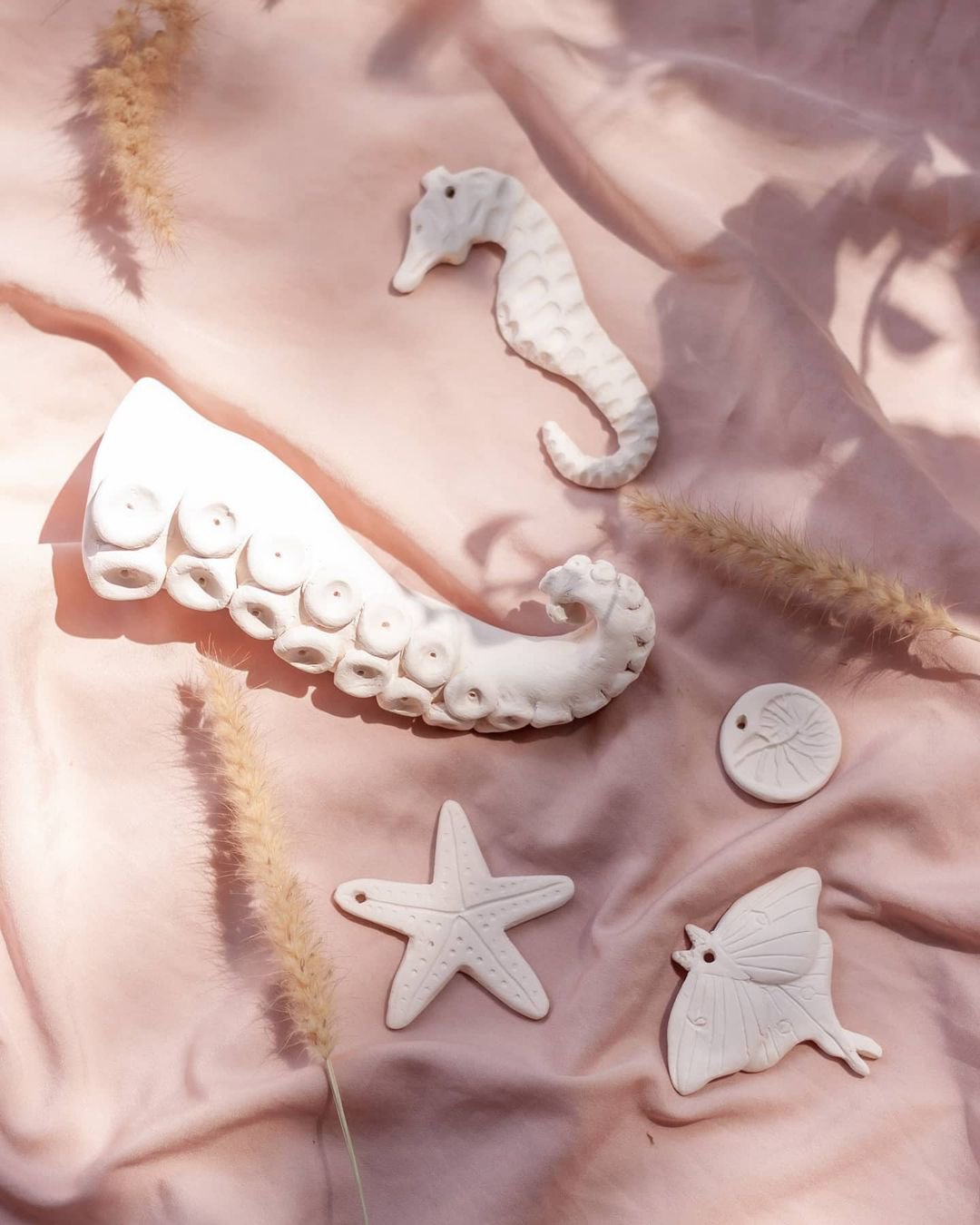 A product by Lacuna Studio over a pink cloth