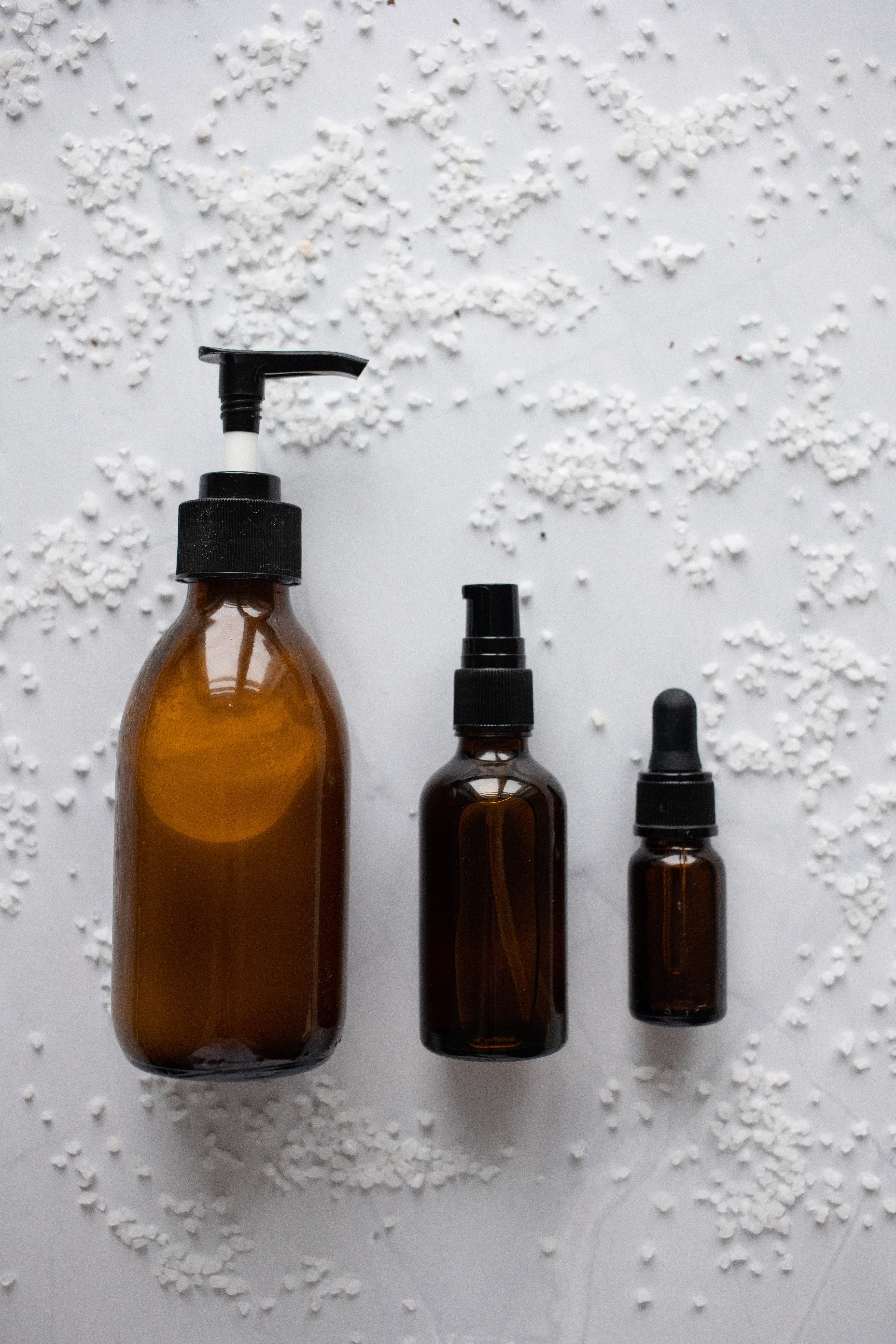 Three different sizes of neem oil bottles